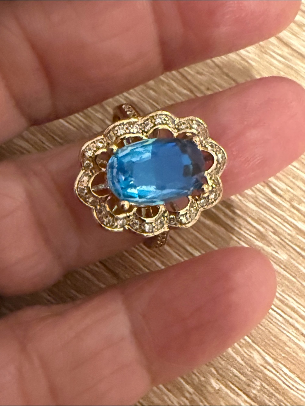 Gold Floral Halo Ring with Blue Center Gem